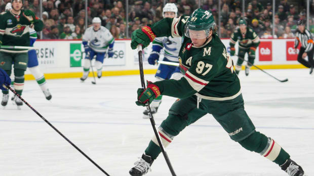Minnesota Wild forward Kirill Kaprizov shoots the puck against the Vancouver Canucks.